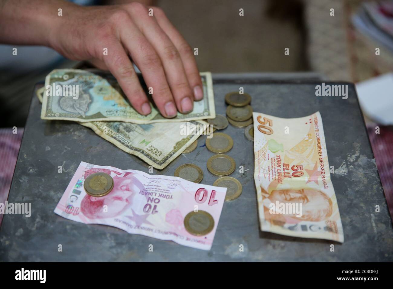 June 17, 2020: Aleppo, Syria. 19 June 2020. A small grocery shop in the  town of Taqad, in the western Aleppo countryside, relies on the Turkish  lira in its trade transactions. On