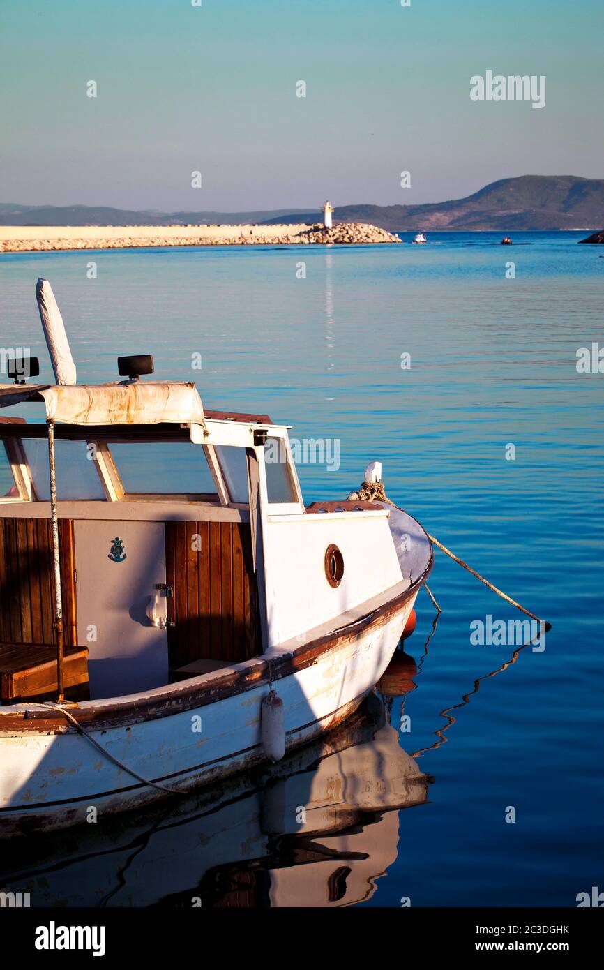 A Fishing Boat and Reflection on Pure Sea Water Stock Photo - Alamy