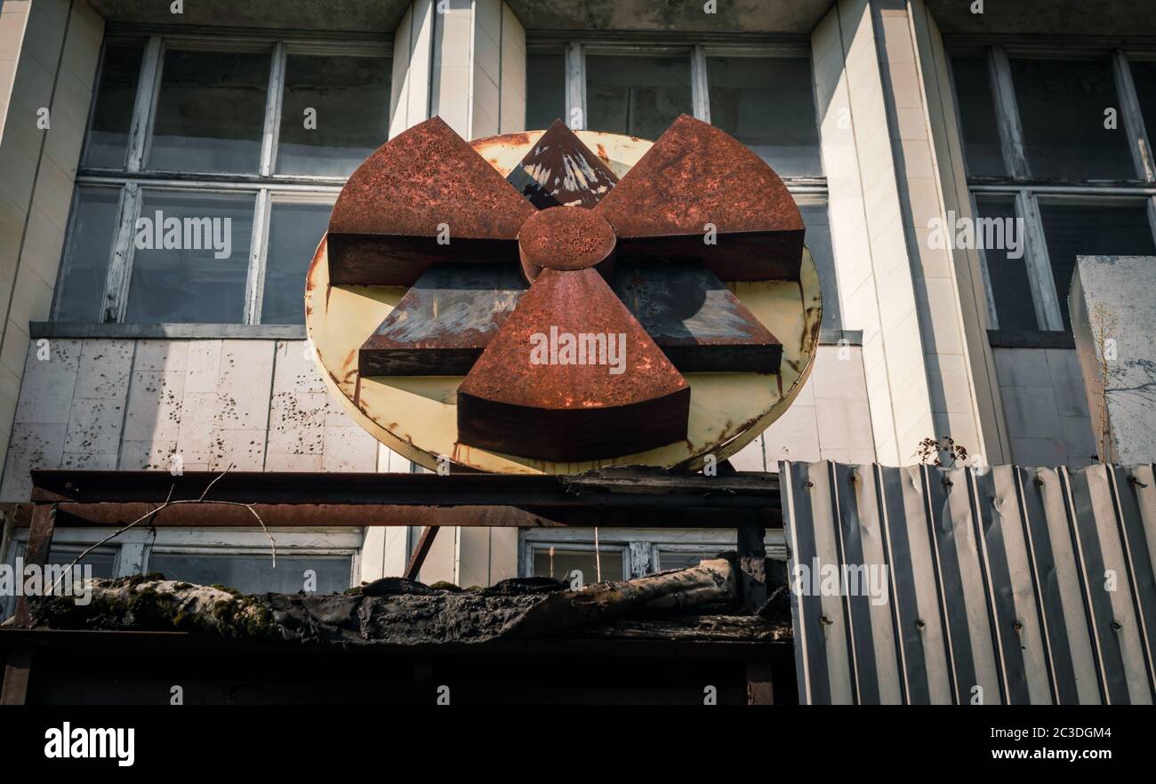 radioactive symbol on the facade of the building in Chernobyl Stock Photo