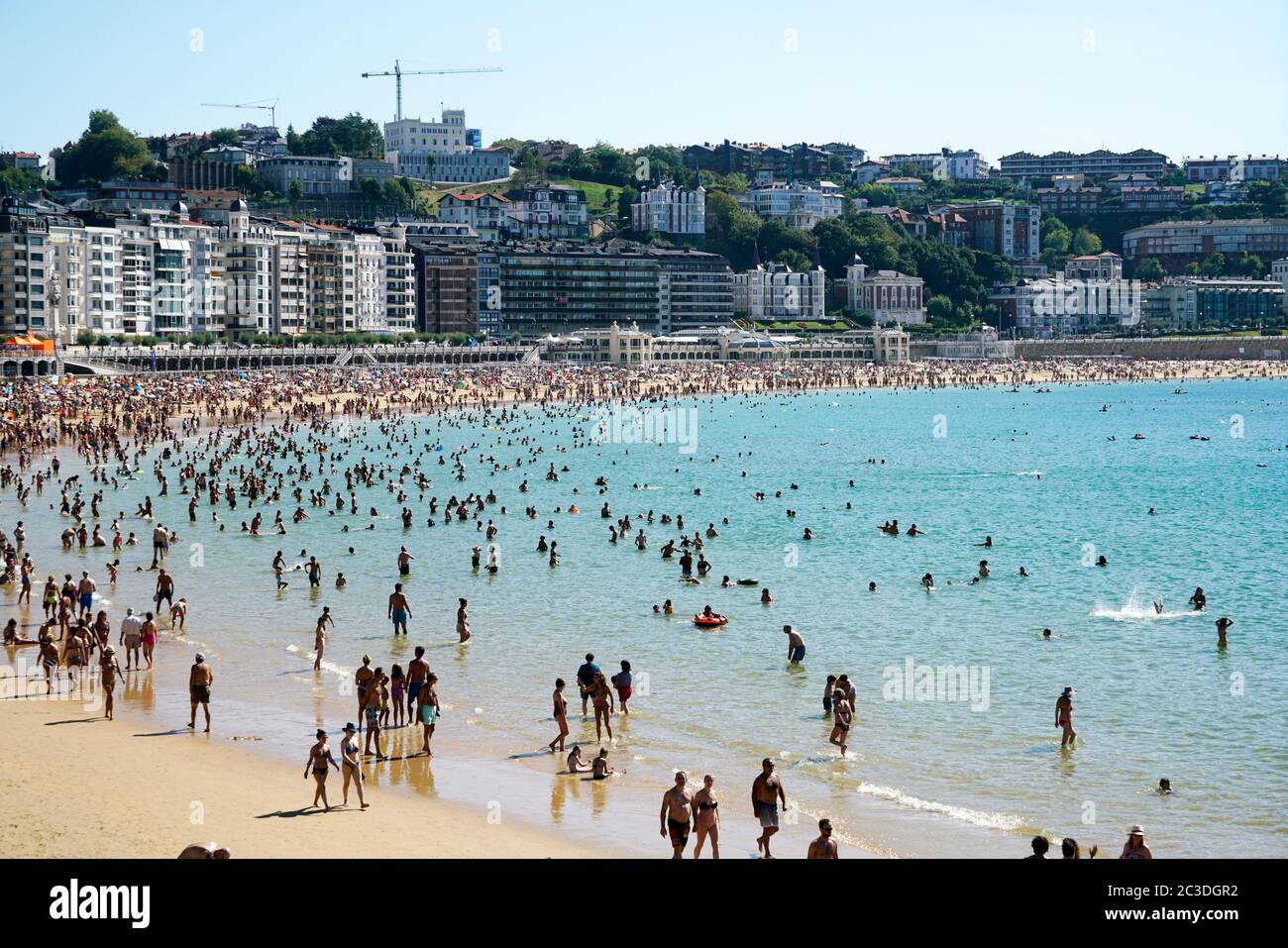 Vacation takers on La Concha Beach. La Concha Bay.San Sebastian.Gipuzkoa.Basque Country.Spain. Stock Photo