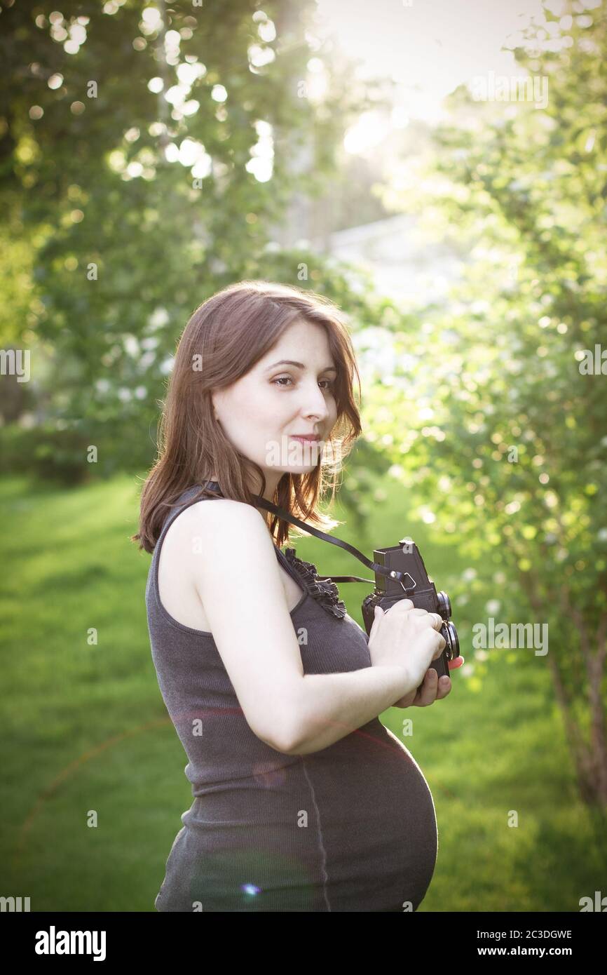 Woman standing to camera hi-res stock photography and images - Alamy