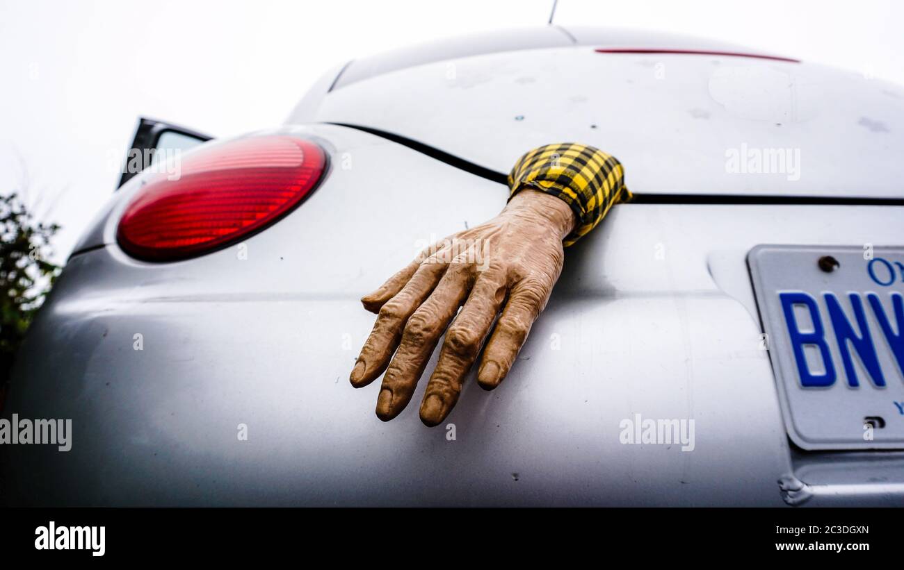 Plastic hand in a trunk of a car at Peggys Cove in Canada. Stock Photo