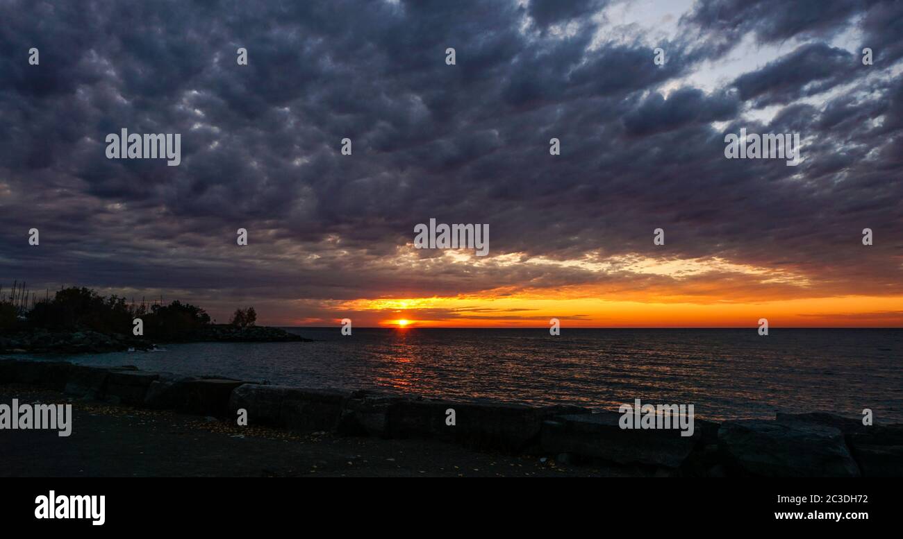 Sunrise over a cloudy sky at the Scarborough Bluffs Park in Toronto, Canada. Stock Photo