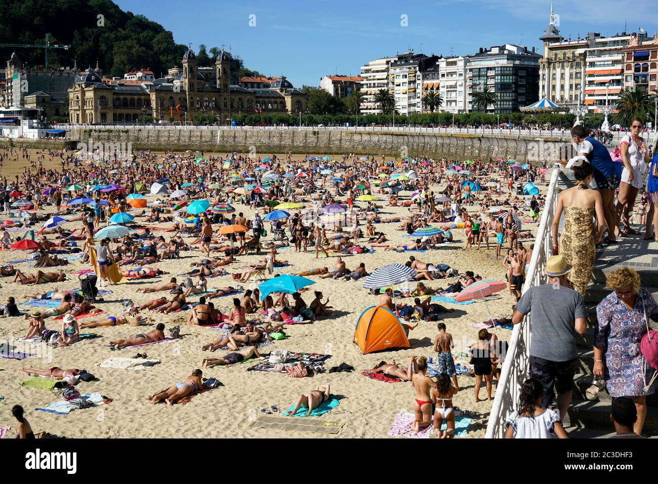 Vacation takers on La Concha Beach. La Concha Bay.San Sebastian.Gipuzkoa.Basque Country.Spain. Stock Photo