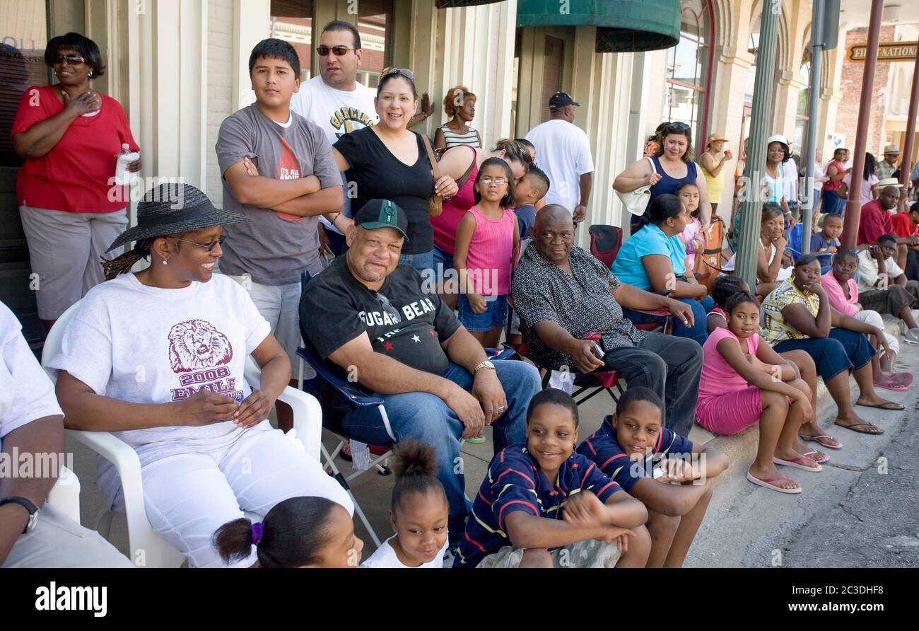 Bastrop, Texas, USA. 21st June, 2008. Bastrop, TX June 21, 2008: Parade-watchers in small-town at a Juneteenth celebration in the historically African-American suburb of Bastrop, outside Austin. Juneteenth celebrates the day, June 19, 1865 when Union soldiers landed in Galveston, TX announcing the end of slavery and the Civil War. Credit: Bob Daemmrich/ZUMA Wire/Alamy Live News Stock Photo