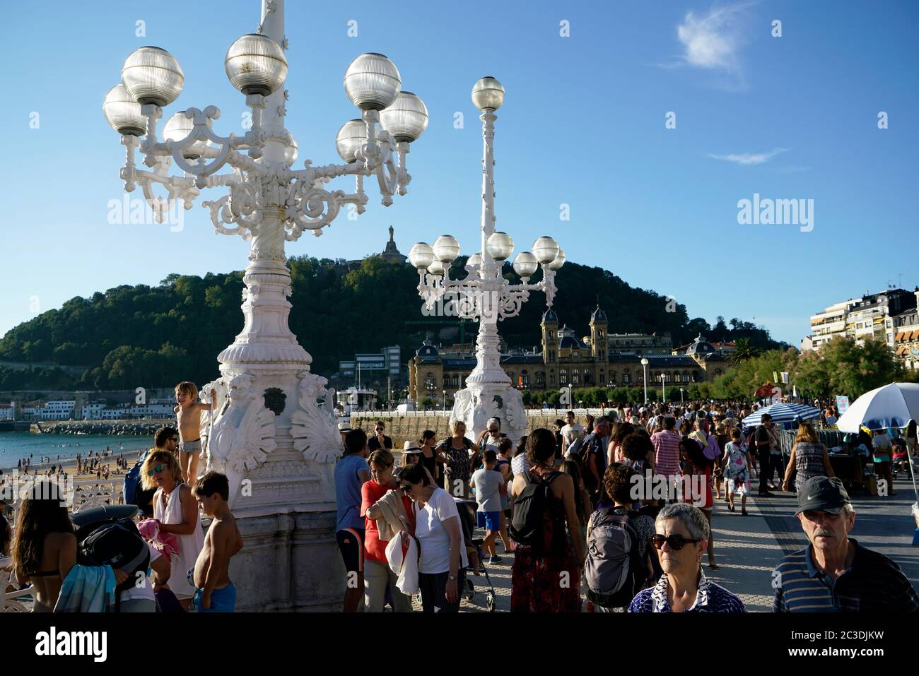 People on the promenade of La Concha Beach. La Concha Bay.San Sebastian