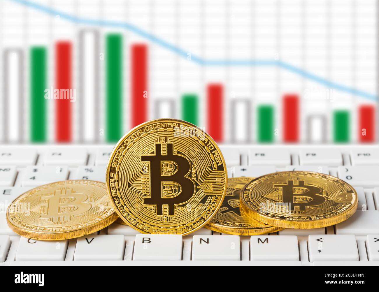 Bitcoins on computer and diagram - business background Stock Photo