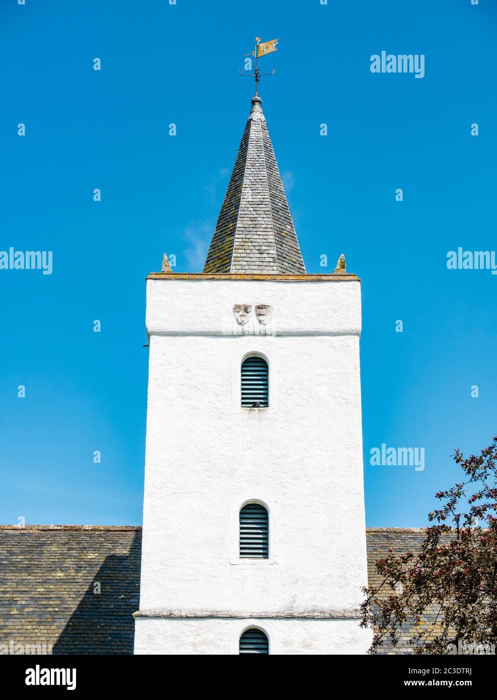Yester Parish Church with square tower spire contrasting with blue sky, Gifford village, East Lothian, Scotland, UK Stock Photo