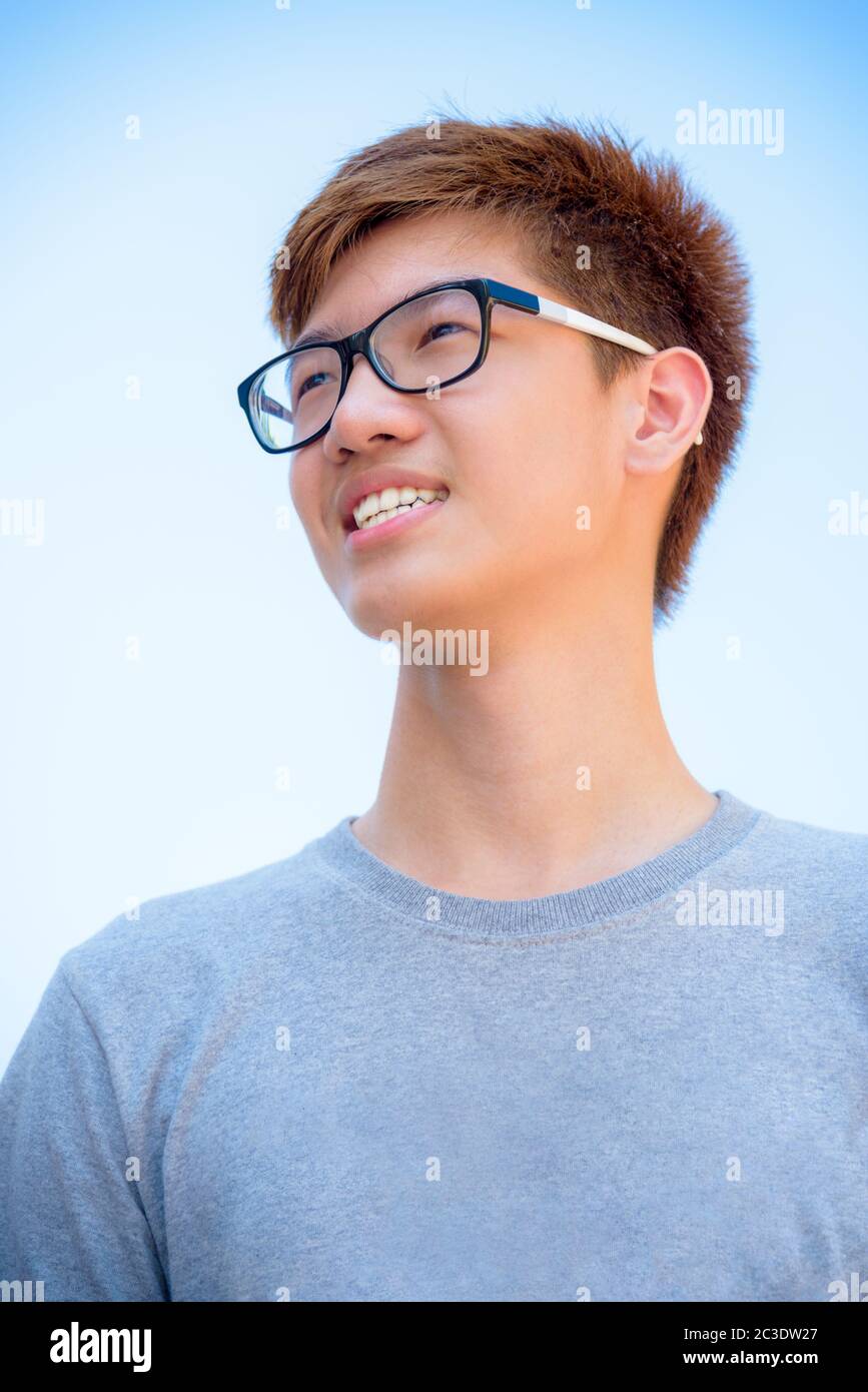 Asian teenage boy wearing glasses Stock Photo - Alamy