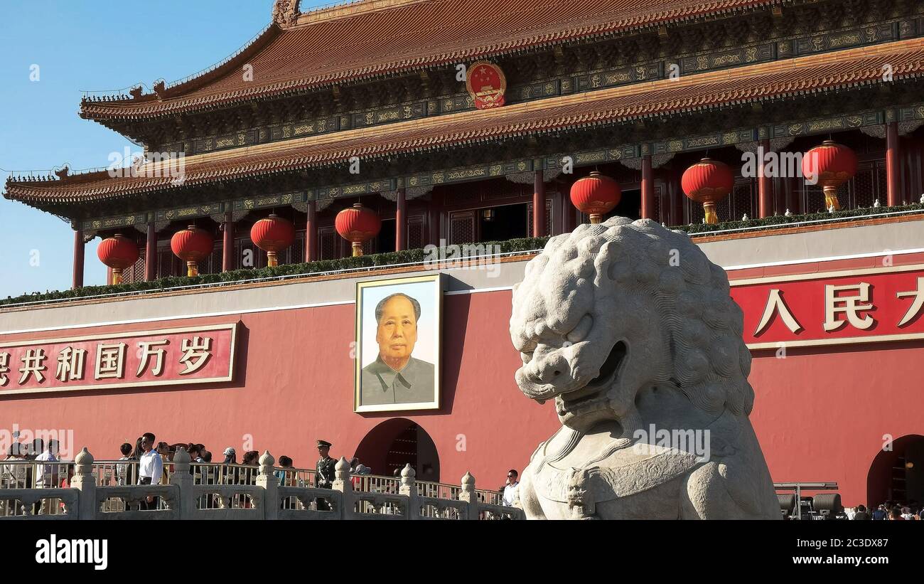 BEIJING, CHINA- OCTOBER, 2 2015: ancient stone lion and mao zedong portrait in tiananmen square, China Stock Photo