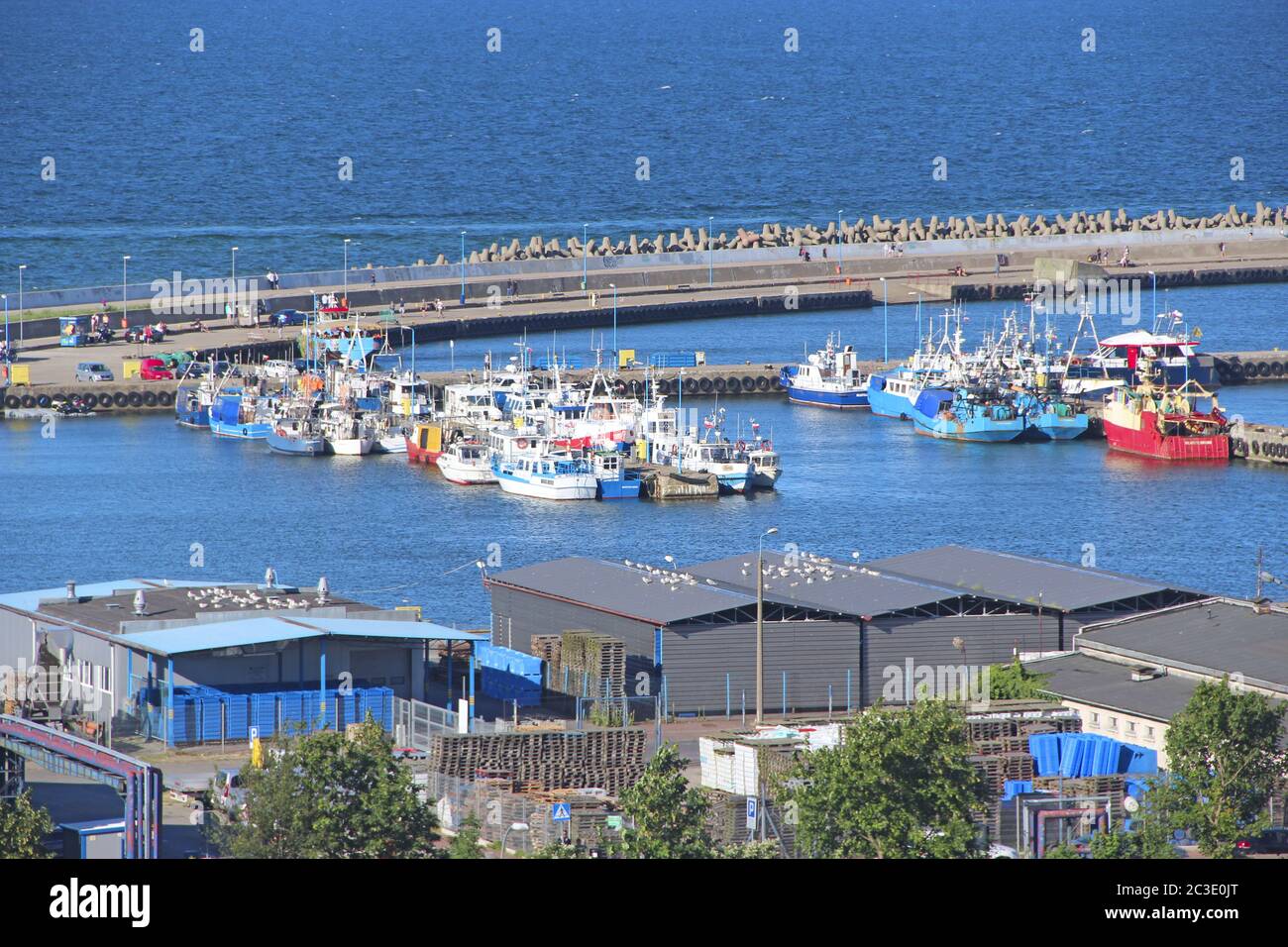 city harbor with many moored boats and ships. Ships and boats in port. Many boats are moored on pier Stock Photo