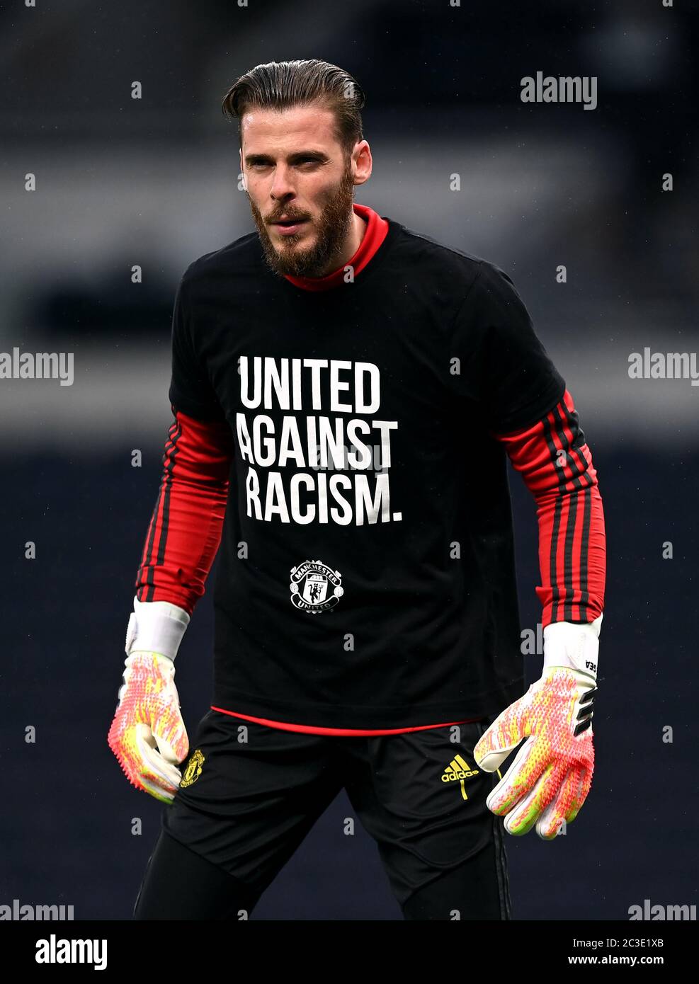 Manchester United goalkeeper David de Gea wearing a United Against Racism t  shirt as he warms up before the Premier League match at the Tottenham  Hotspur Stadium, London Stock Photo - Alamy