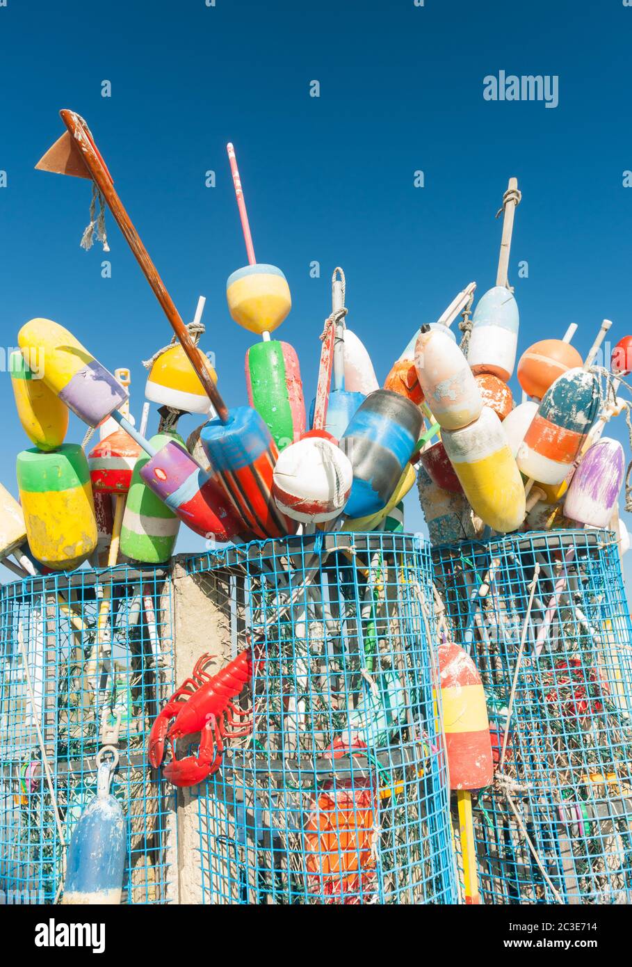 Collection of colorful fishing or lobster trap buoys and markers at wharf in Provincetown