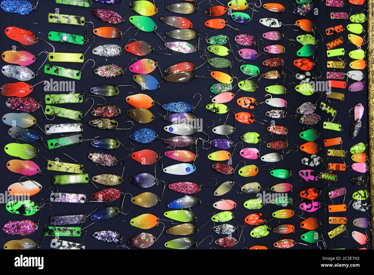 Colorful fishing lures on sale. Plug with hook. Set of different plugs for fishing. Colorful fishing Stock Photo