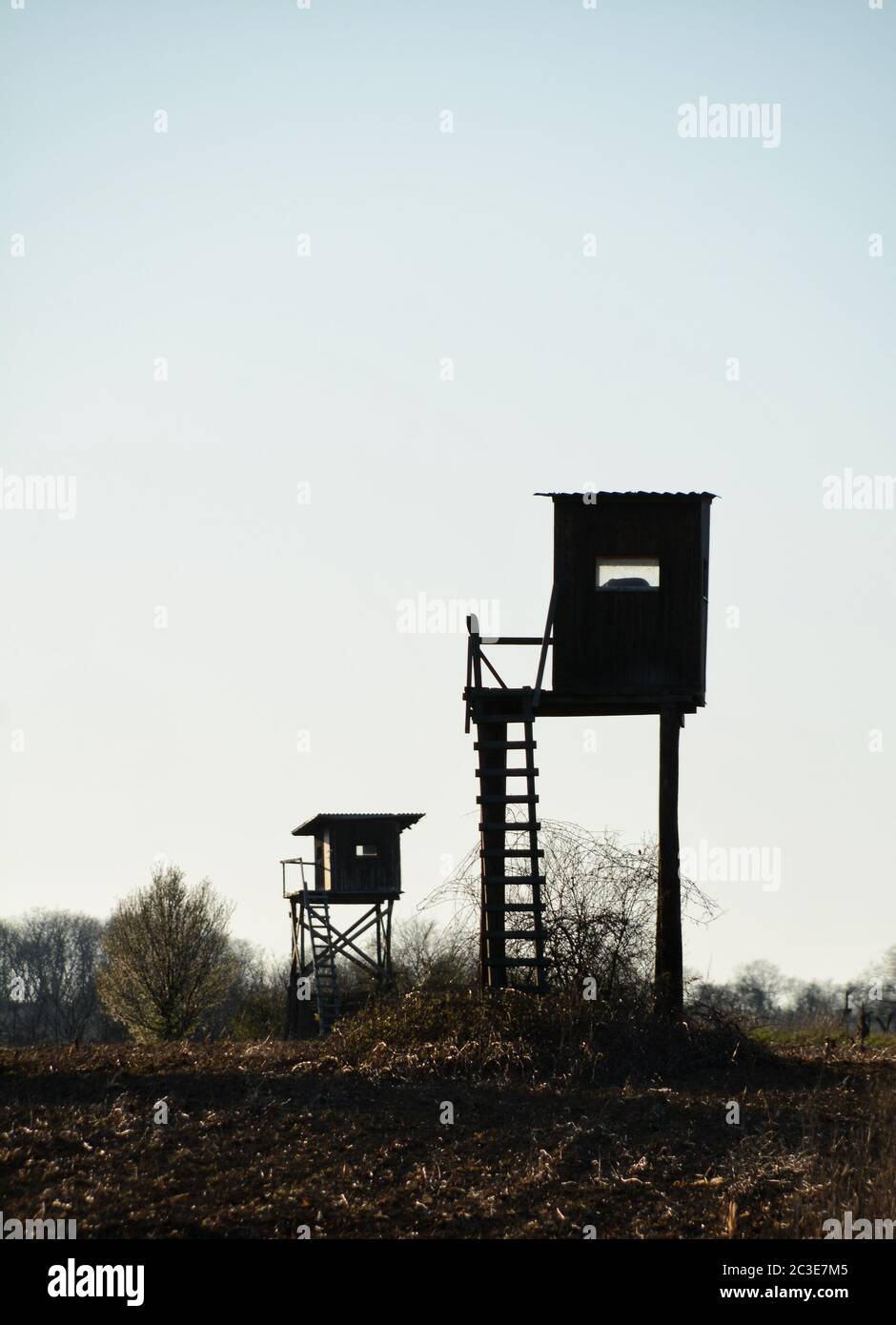 Watch towers on a border in a field Stock Photo