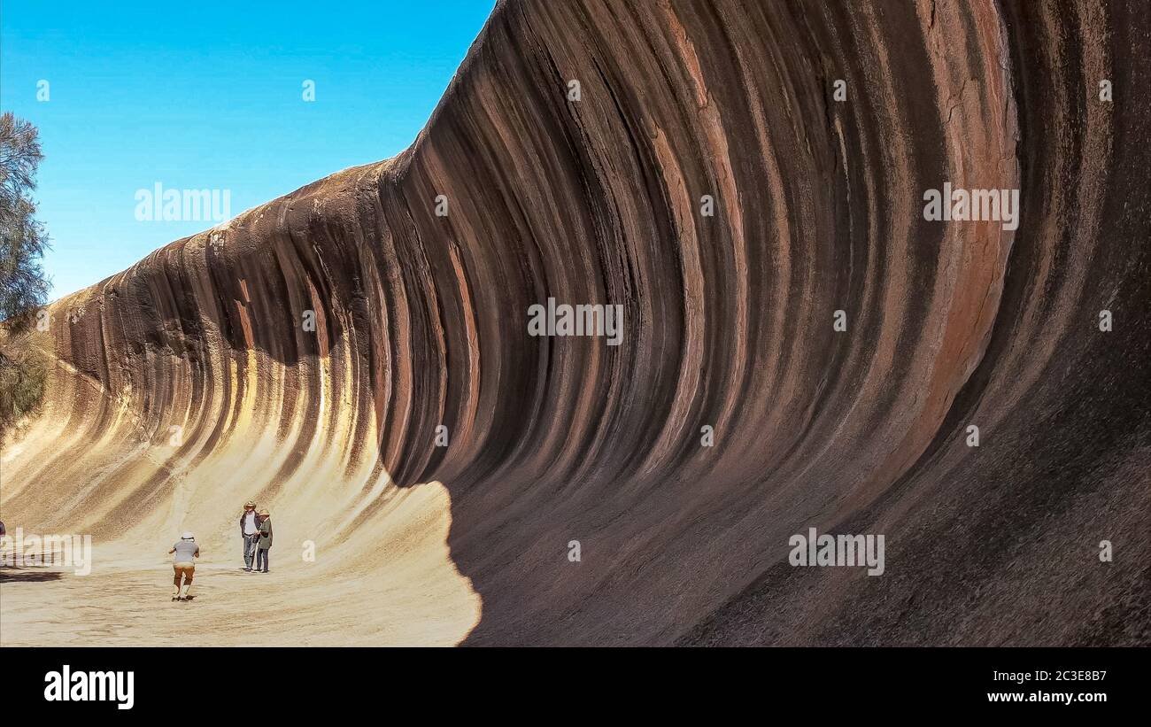 wave rock and tourists posing for photos Stock Photo
