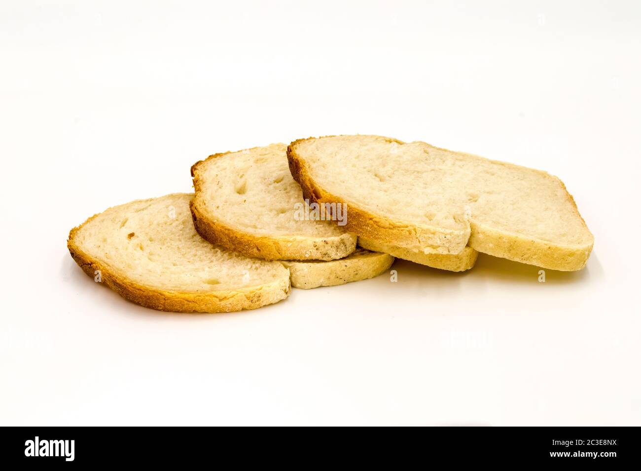 Wheat bread with bran slice. Cooking the dough. Isolated on white background. Stock Photo