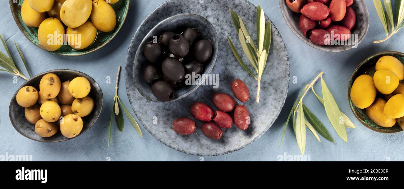 Olives overhead panorama. An assortment of green, black and brown olives, shot from above Stock Photo