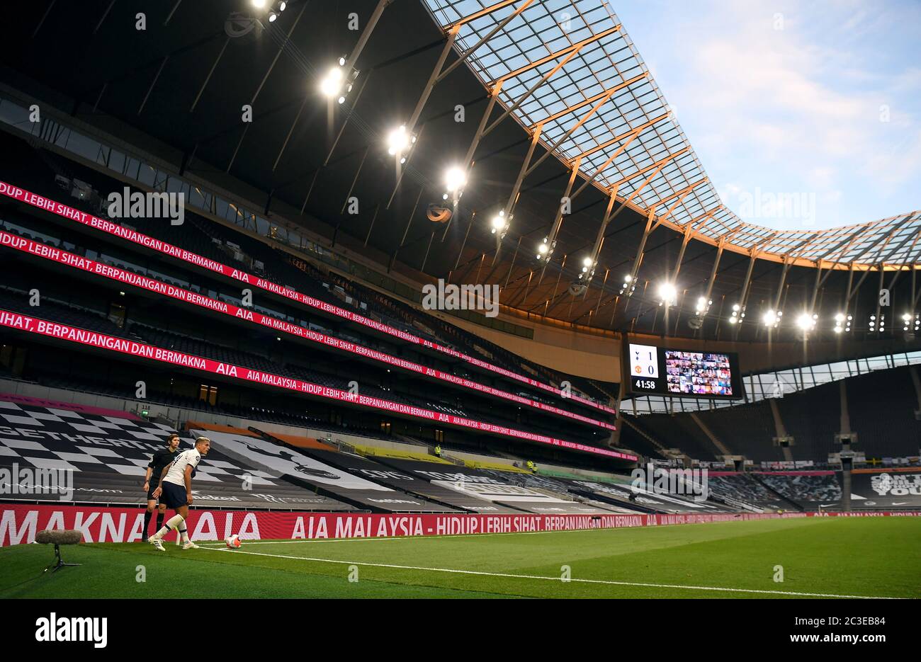 Tottenham Hotspur S Erik Lamela Prepares To Take A Corner Surrounded By Empty Stands During The Premier League Match At The Tottenham Hotspur Stadium London Stock Photo Alamy