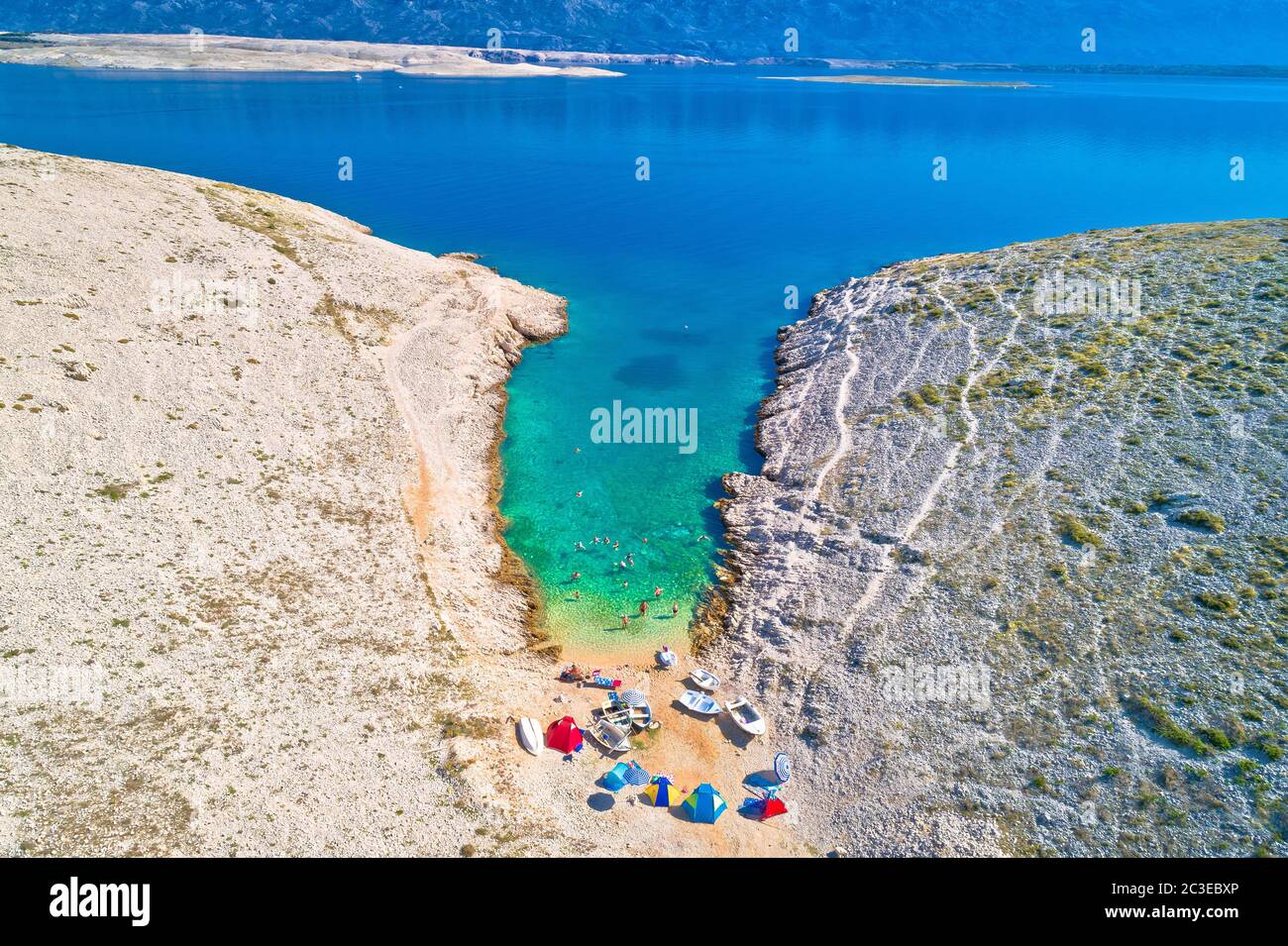 Vrsi. Zadar archipelago idyllic cove beach in stone desert scenery near Zecevo island Stock Photo