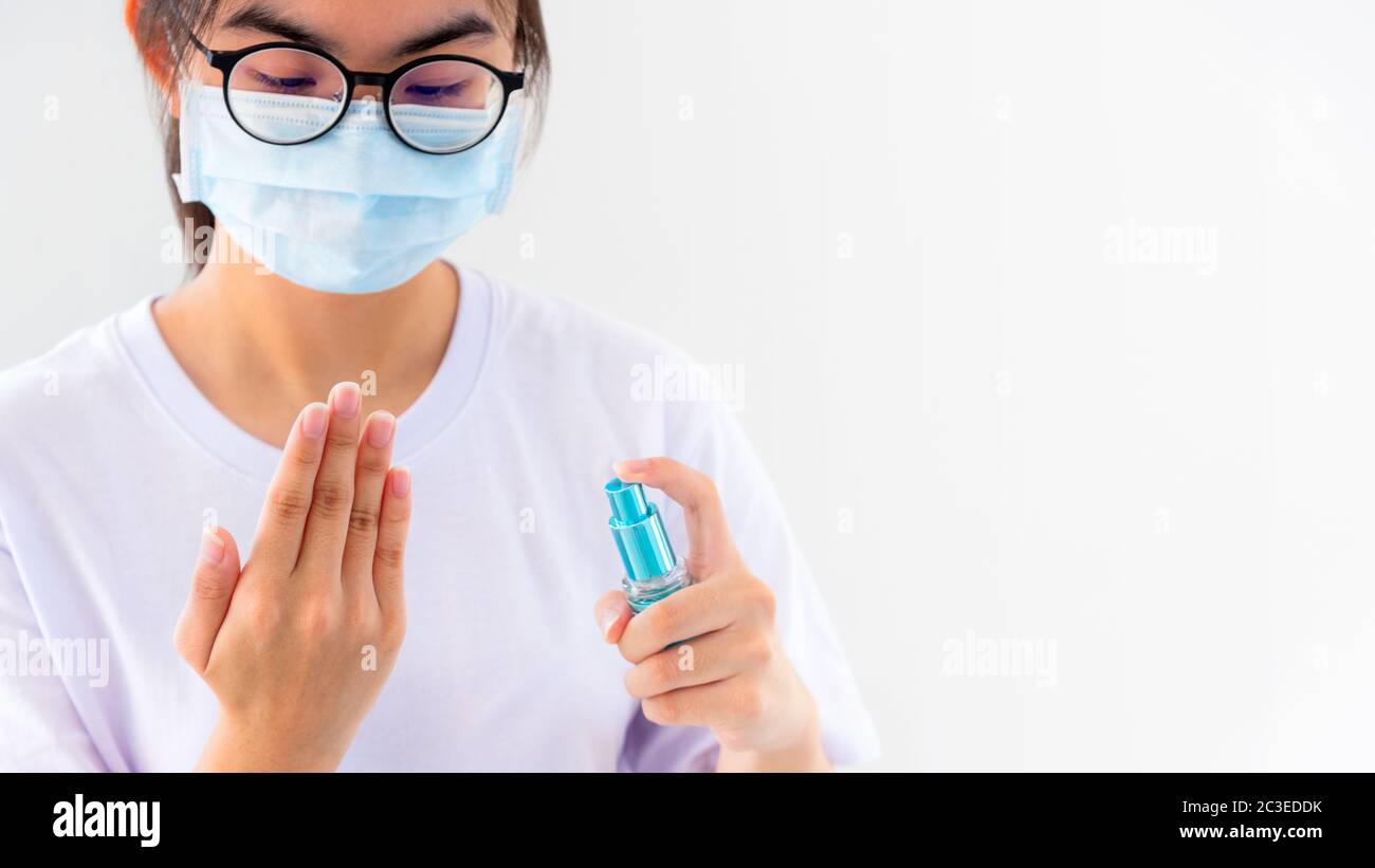 Hand cleaning with alcohol spray Stock Photo Alamy
