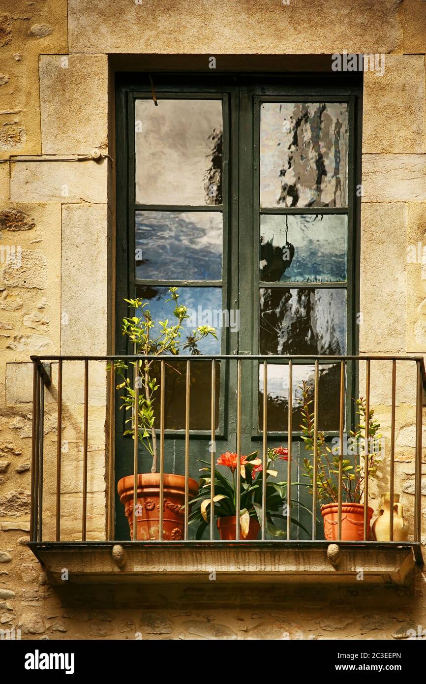 Spanish Windows with Balcony, Decorated With Fresh Flowers, Vintage