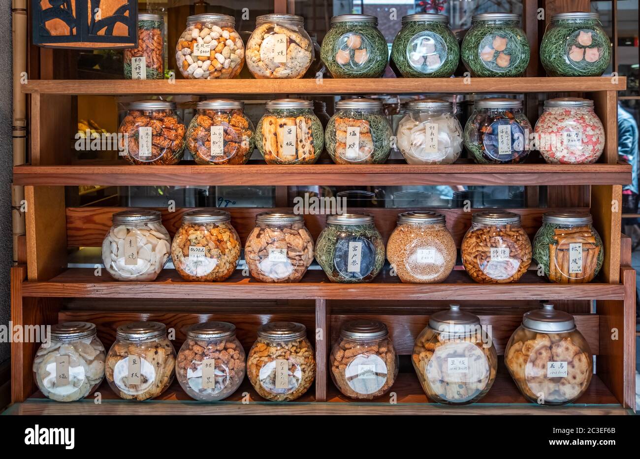 Rows of traditional Japanese crackers in a round jar, Asakusa Street, Tokyo, Japan Stock Photo