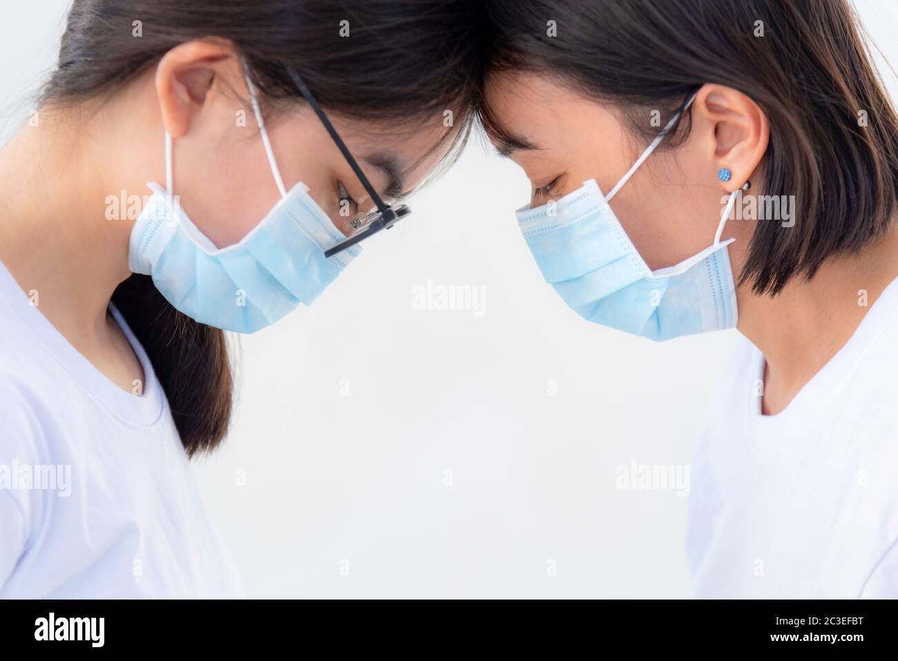 Mother and daughter wear a mask Stock Photo