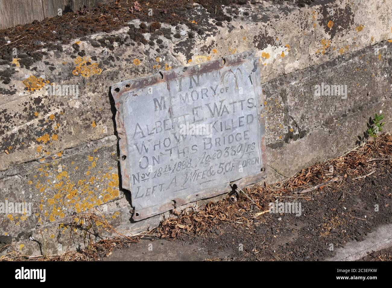 June 2020 - Old memorial plaque to Albert E Watts who died on this bridge in rural Somerset. Stock Photo