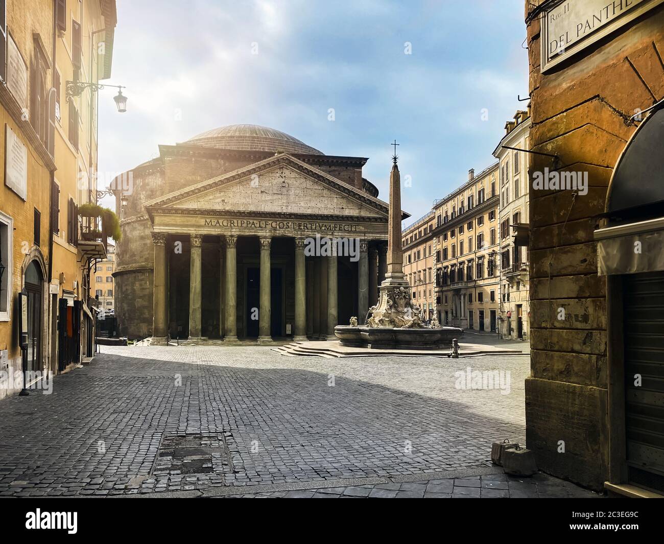 The Pantheon and the fountain in Piazza della Rotonda in Rome seen from Via del Pantheon. Stock Photo