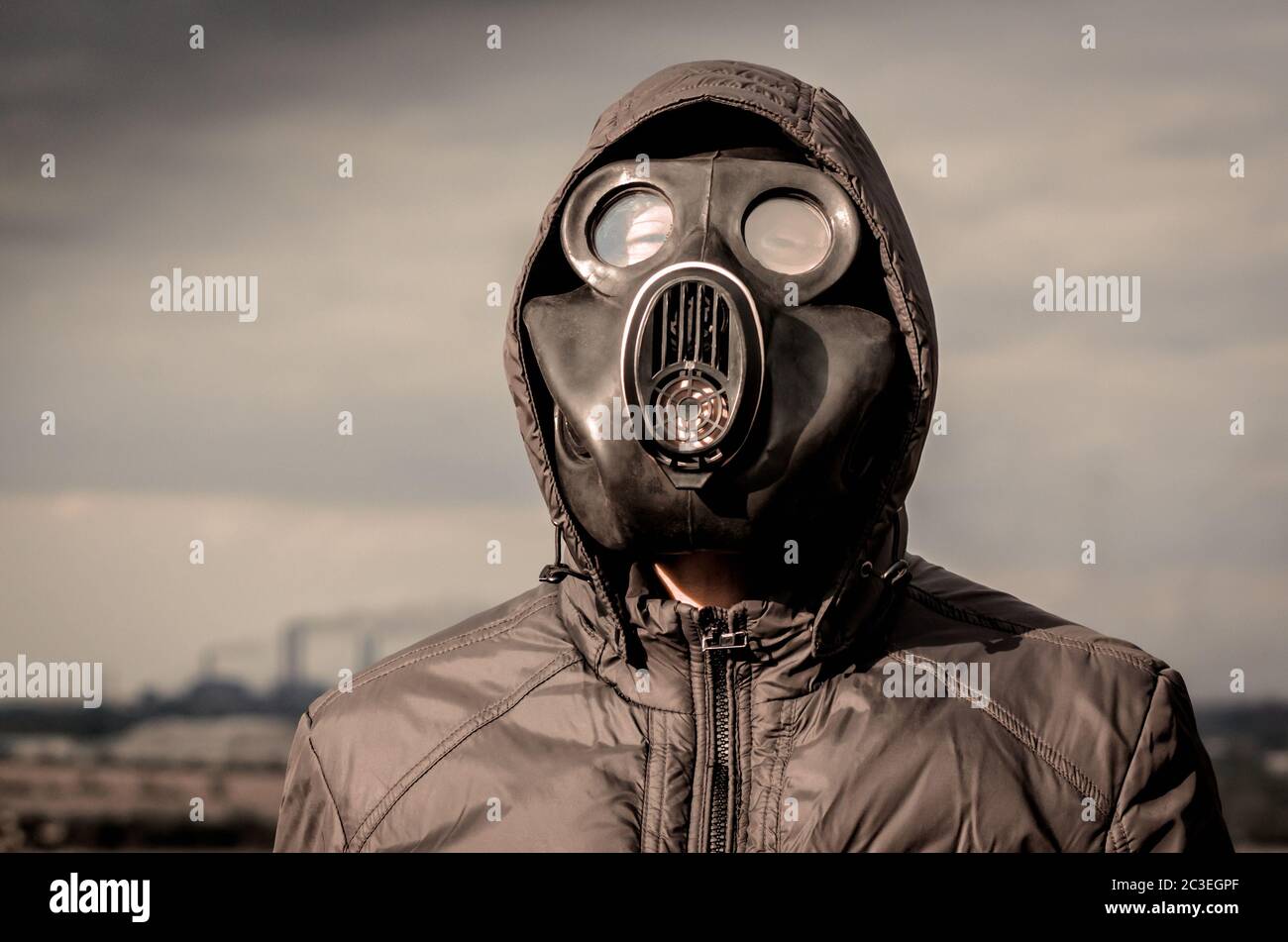 portrait of a man in a gas mask and a hood close up Stock Photo - Alamy