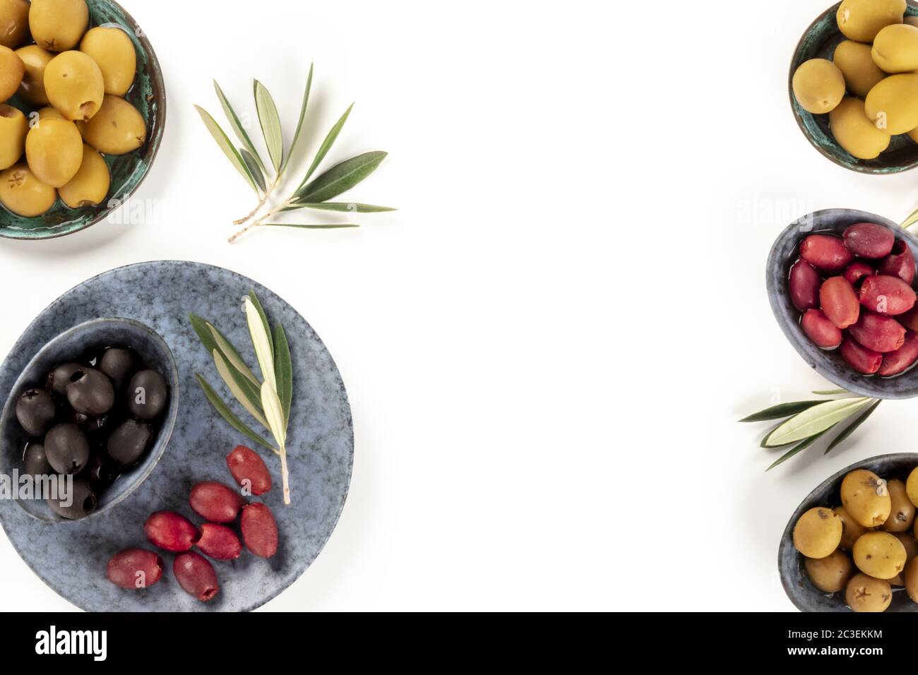 Olives background with a place for text. A flat lay of green, black and red olives, shot from the top on white Stock Photo
