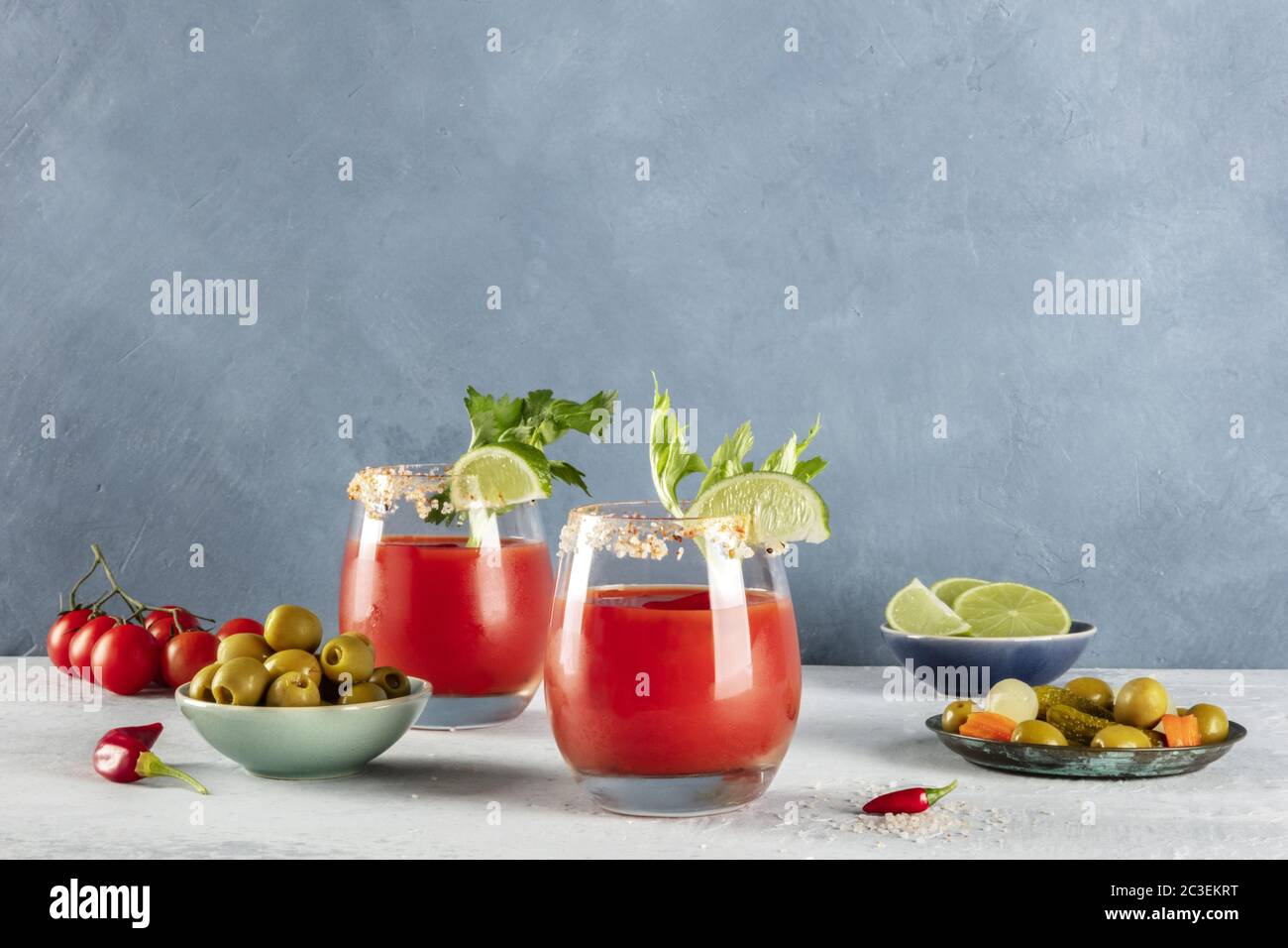 Bloody Mary cocktail with tomato juice, lime, and celery, a side view