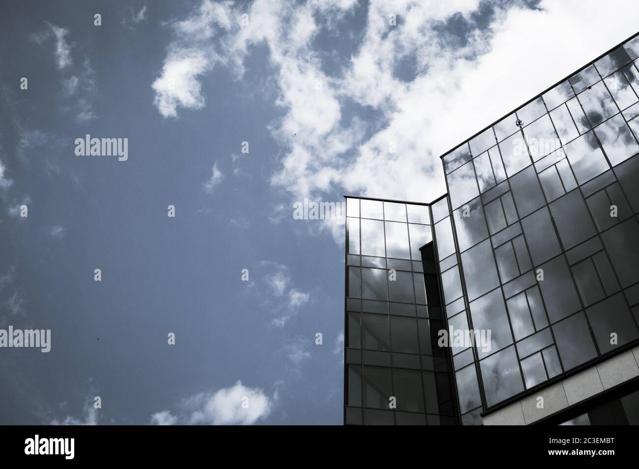 modern corporate building with clouds reflecting in the glass Stock ...