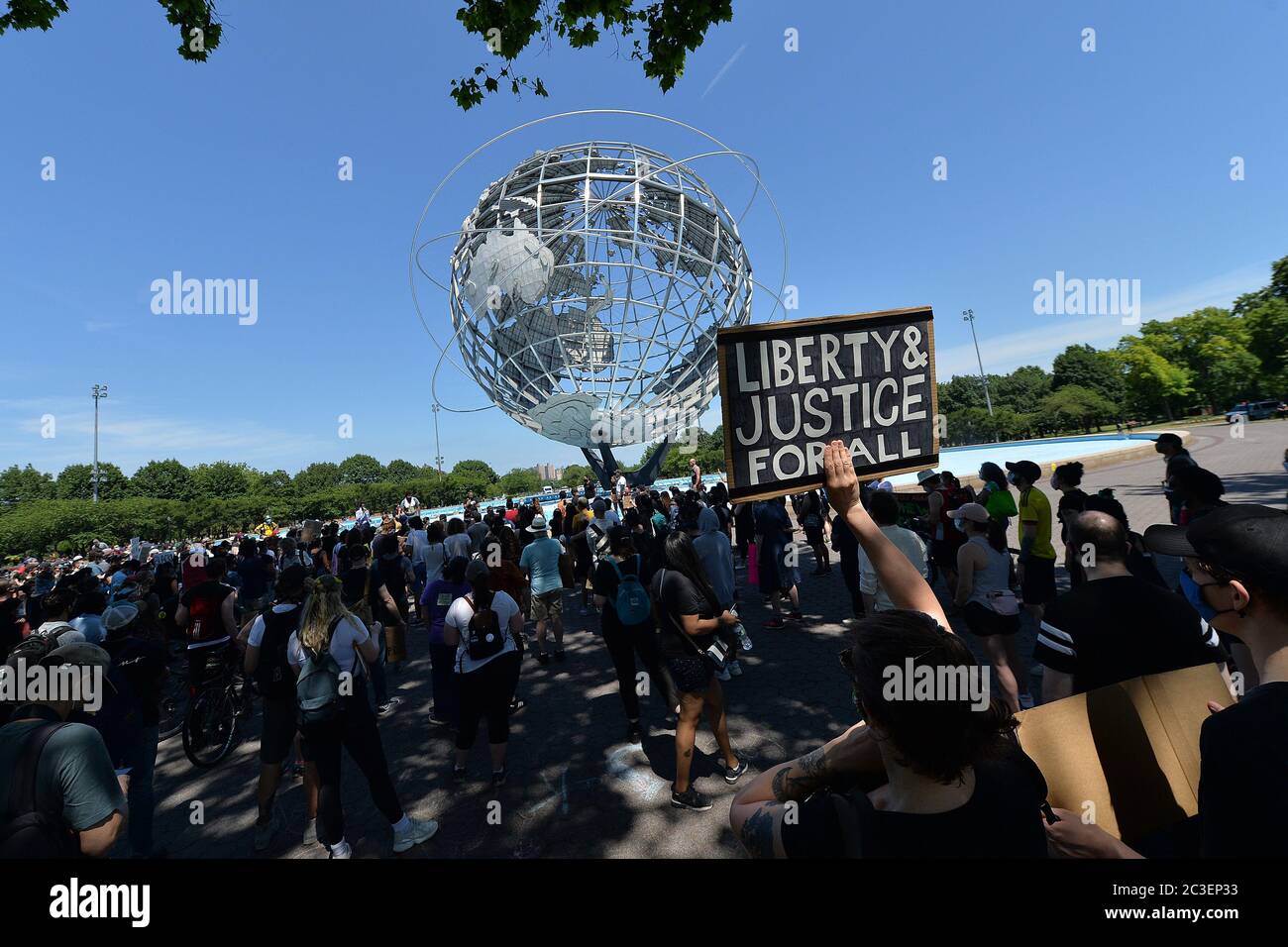 A marcher holds a sign up at a Juneteenth celebration rally held in front of the Unisphere in Flushing Meadows-Corona Park in the borough of Queens, New York, June 19, 2020. Juneteenth is celebrated as a commemoration of the ending of slavery in the United States.   given on January 1, 1983, which was not enforced in Texas due to a lac Credit: Sipa USA/Alamy Live News Stock Photo