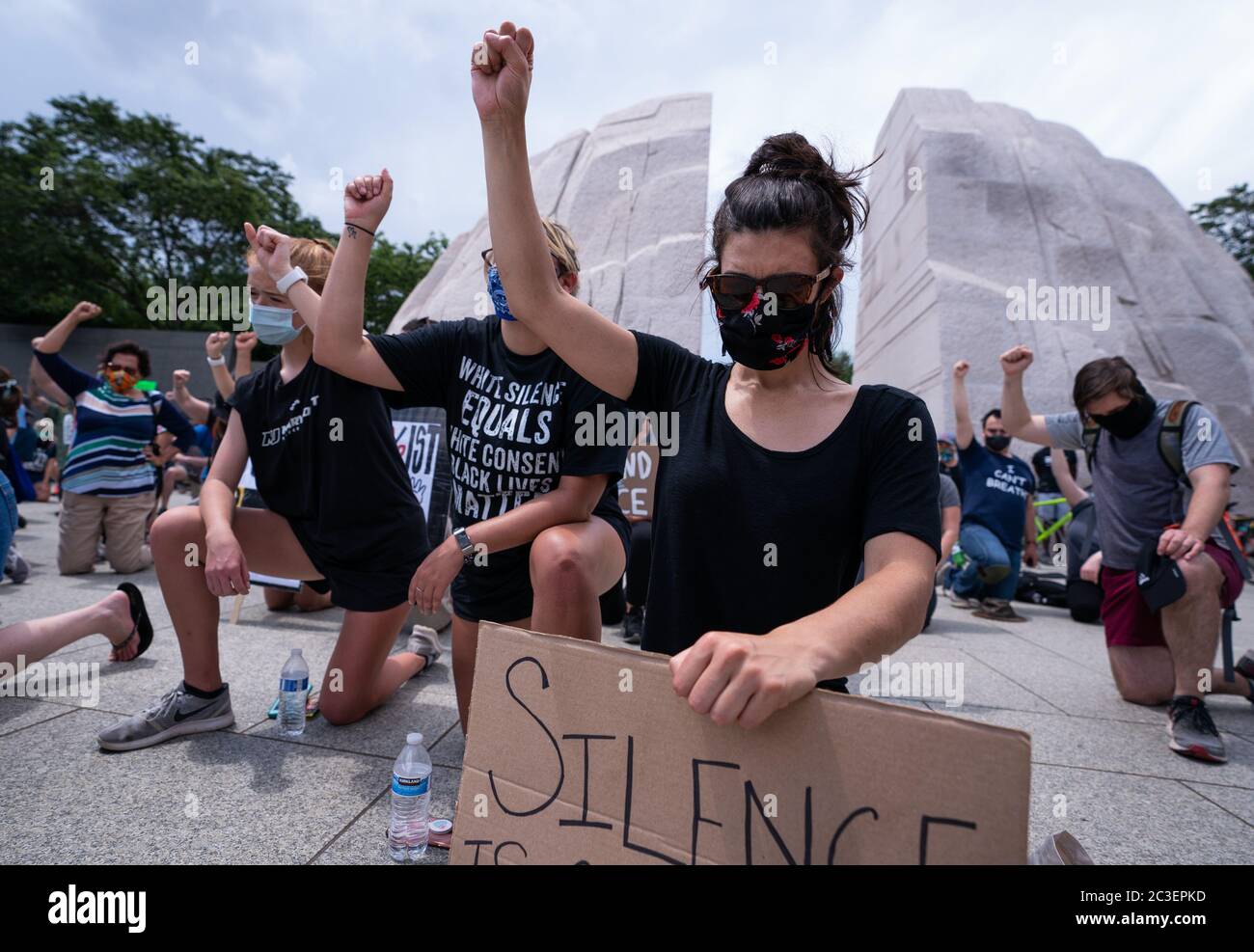 Washington, United States. 19th June, 2020. Demonstrators take part in a Juneteenth rally as they kneel at the Martin Luther King Jr. Memorial on Friday, June 19, 2020 in Washington, DC. Juneteenth, July 19th, marks the date of the end of slavery in the United States. Photo by Kevin Dietsch/UPI Credit: UPI/Alamy Live News Stock Photo
