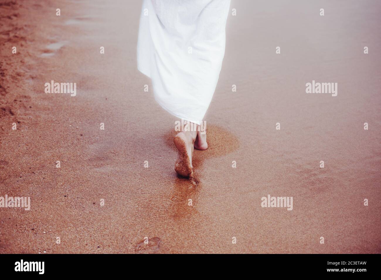 walking on sandy beach Stock Photo
