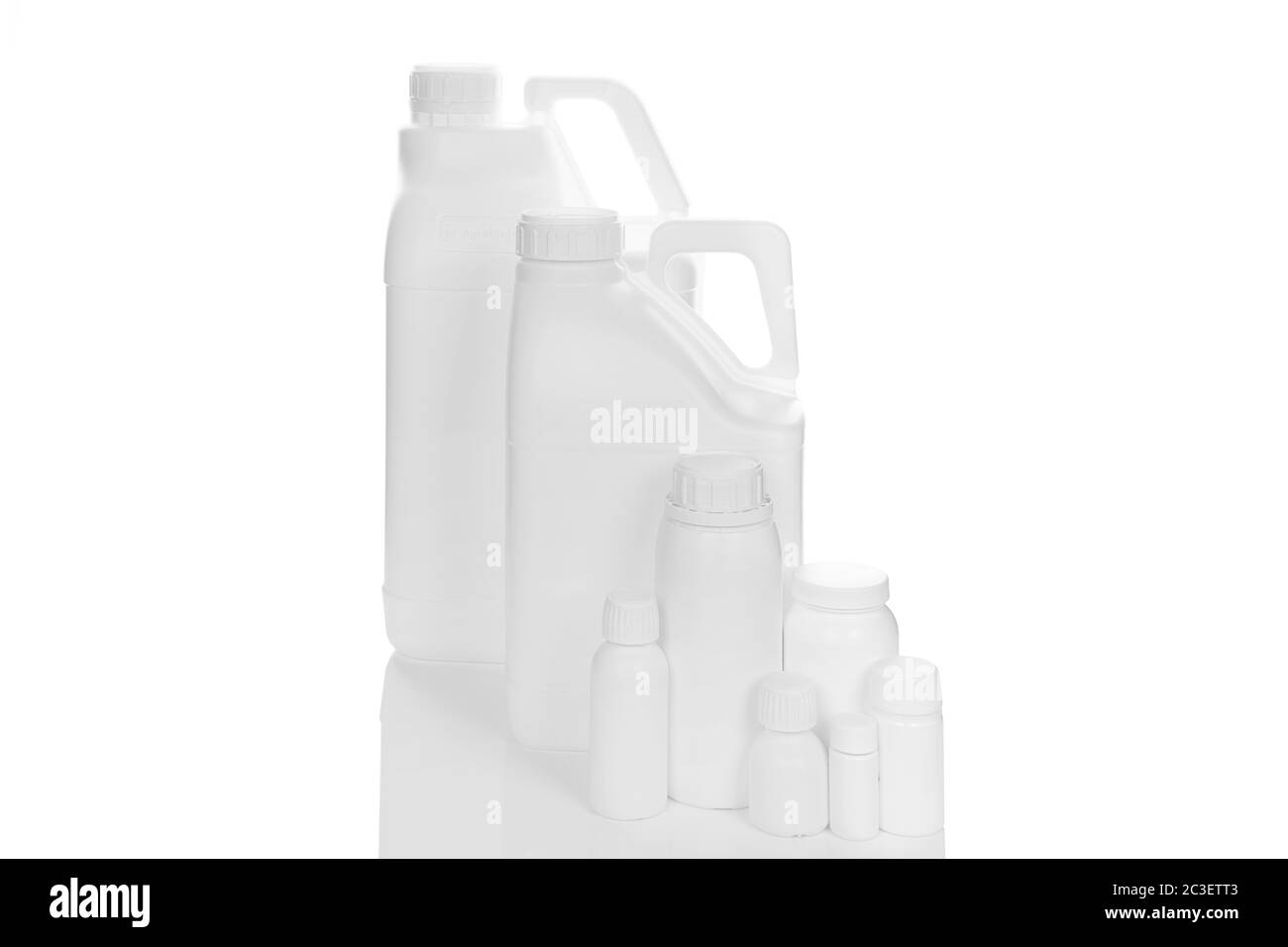 White bottles on white background Stock Photo - Alamy