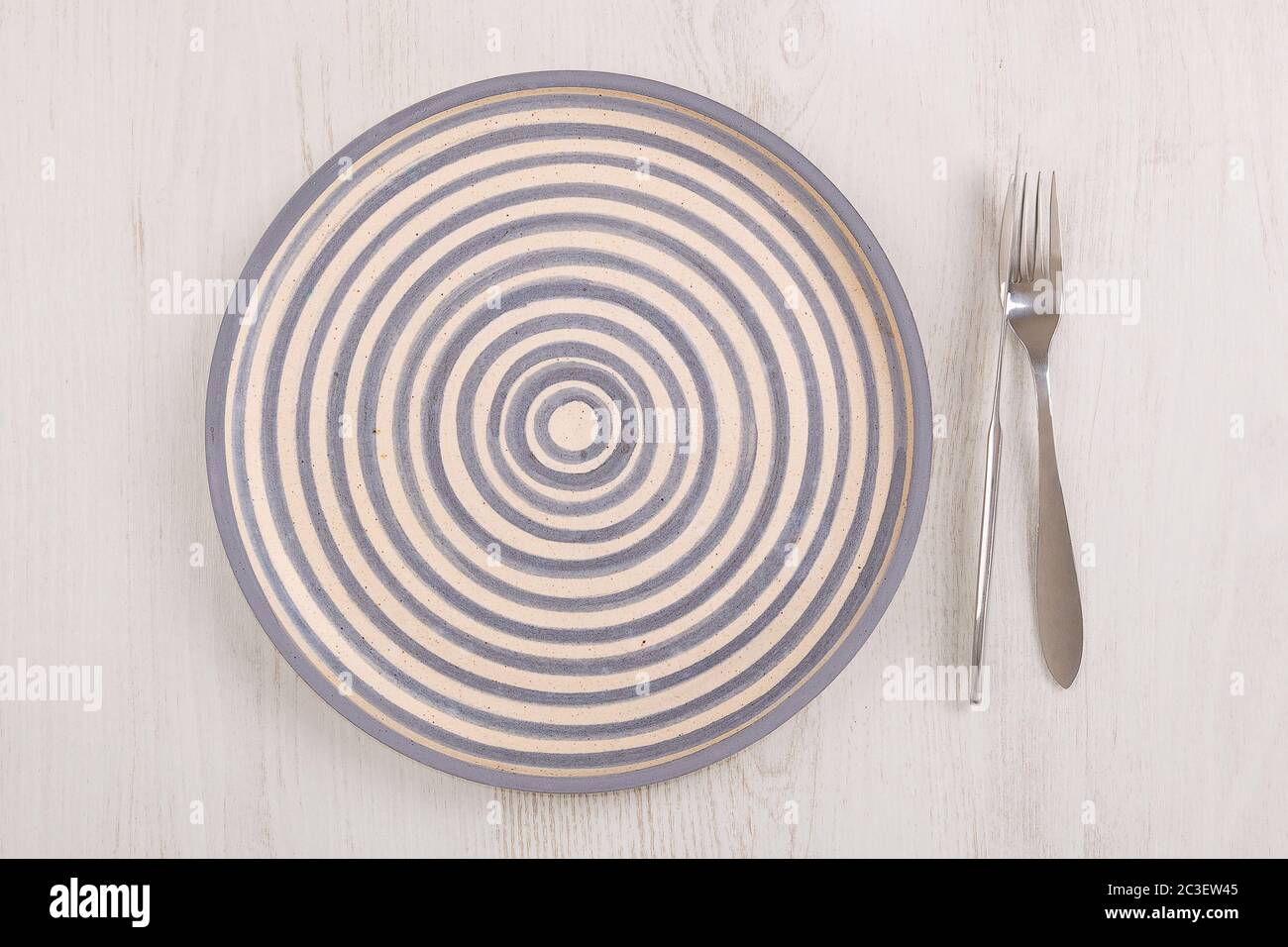 Vintage kitchen utensils plate, knife and fork Stock Photo Alamy