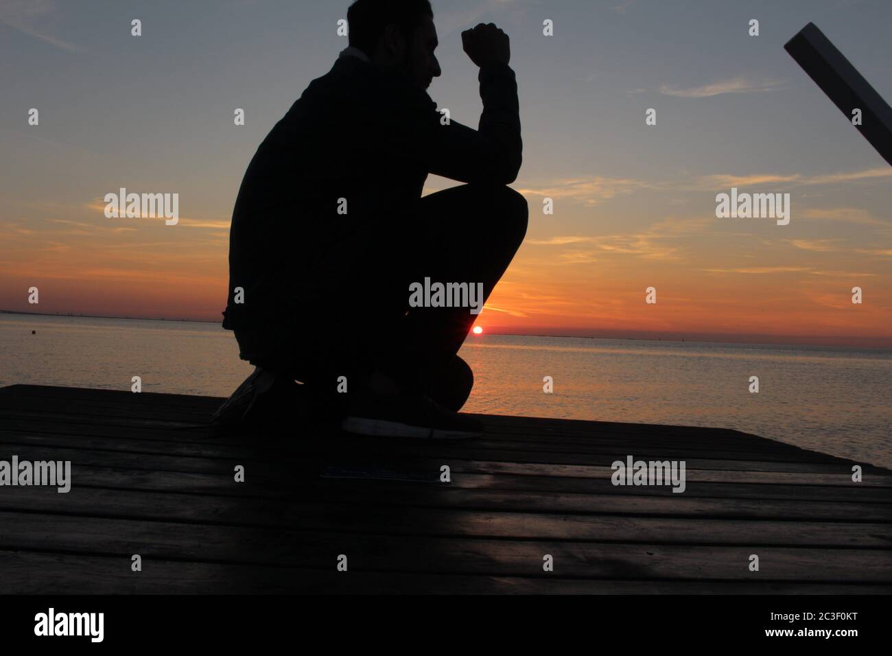Kneeling silhouette hi-res stock photography and images - Alamy
