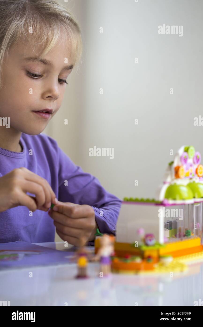 Girl (7) builds a house from Lego blocks, Kiel, SchleswigHolstein