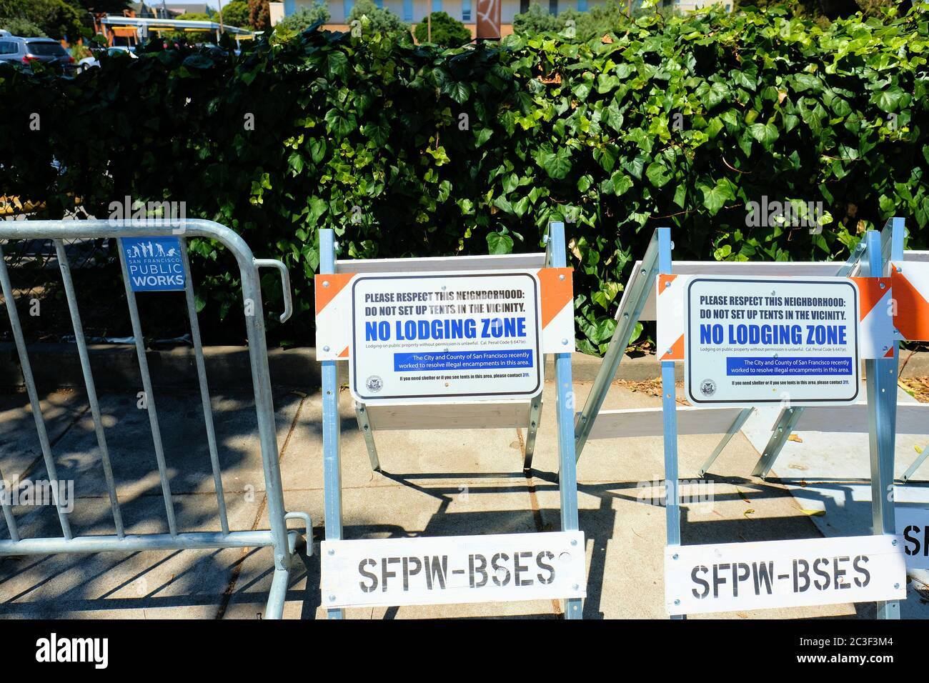Signs warning homeless people against illegal encampments in a San