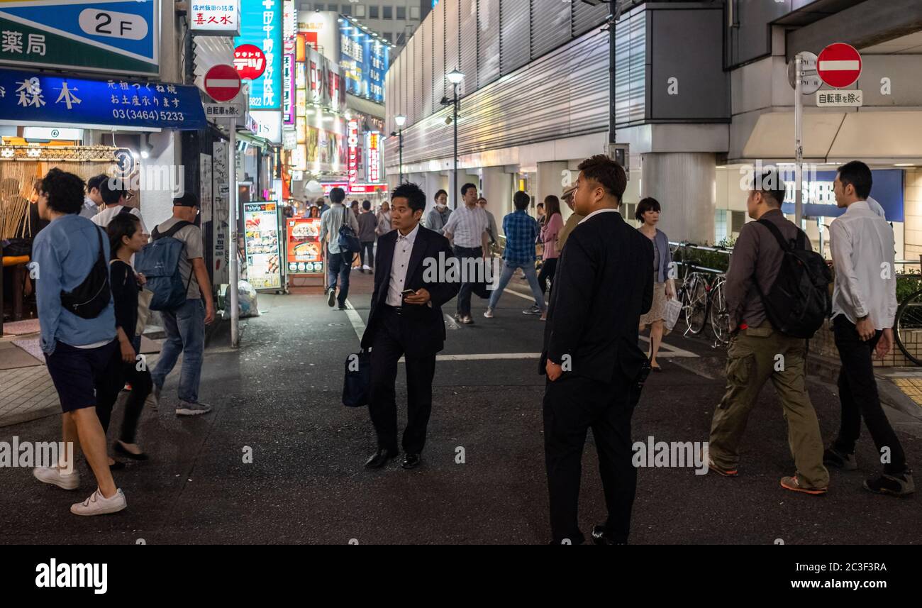 Pedestrian walking in Shibuya street a night, Tokyo, Japan. Stock Photo