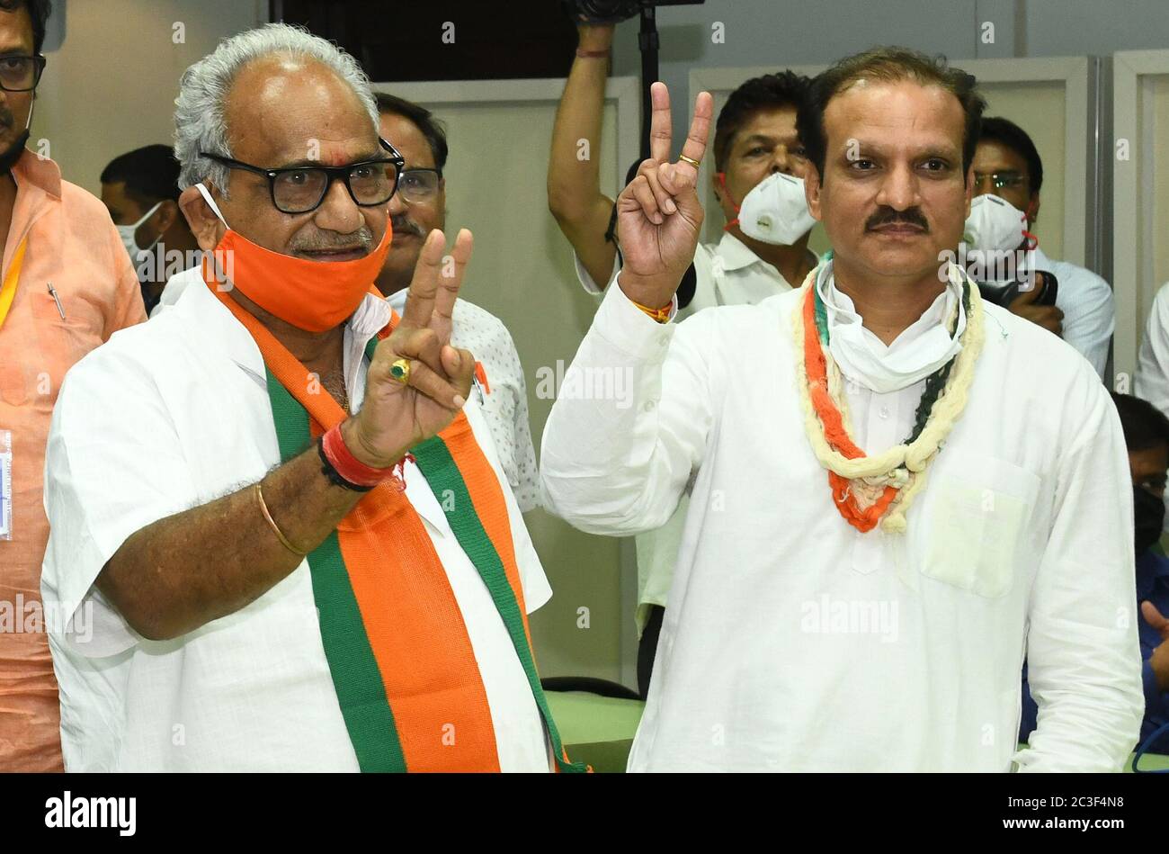 BJP candidate Rajendra Gehlot (L) and Congress candidate Neeraj Dangi (R) flashes victory sign after winning Rajya Sabha (Council of States) Election, at State Assembly in Jaipur. Congress wins 2 and BJP 1 seat in Rajasthan. Voting was held on June 19 to fill 19 vacant Rajya Sabha seats in eight states. These include Gujarat, Madhya Pradesh, Manipur, Mizoram, Jharkhand, Andhra Pradesh, Meghalaya and Rajasthan. BJP wins 8, Congress and YSRCP 4 each while JMM, MNF, NPP secure 1 seat each in the country. (Photo by Sumit Saraswat/Pacific Press) Stock Photo