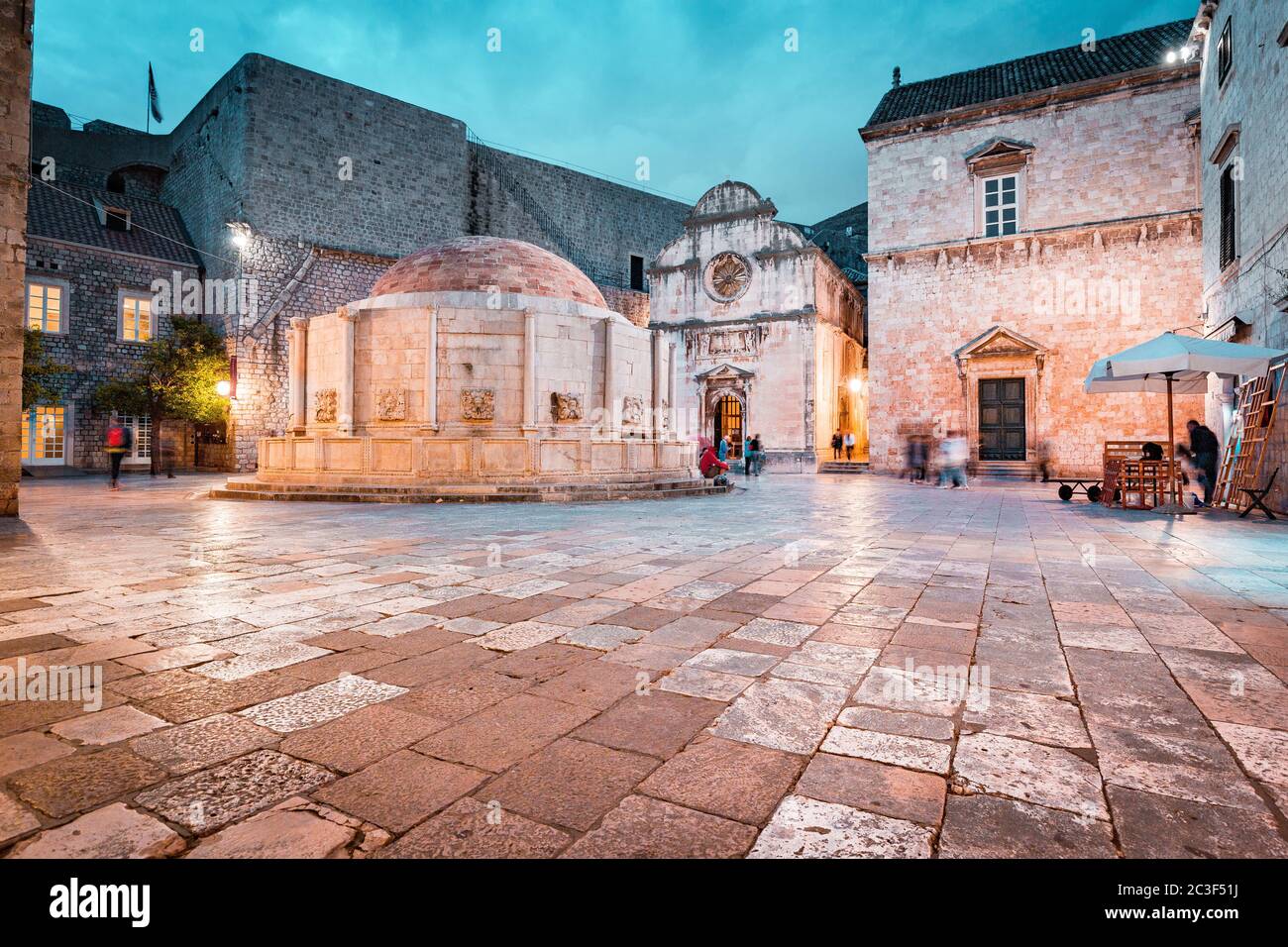 Beautiful twilight view of the historic town of Dubrovnik with famous Onofrio's fountain at dusk , Dalmatia, Croatia Stock Photo