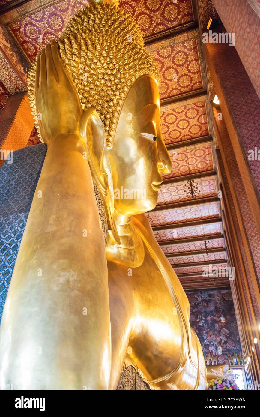 Statue of Reclining Buddha in temple Wat Pho, Bangkok Stock Photo