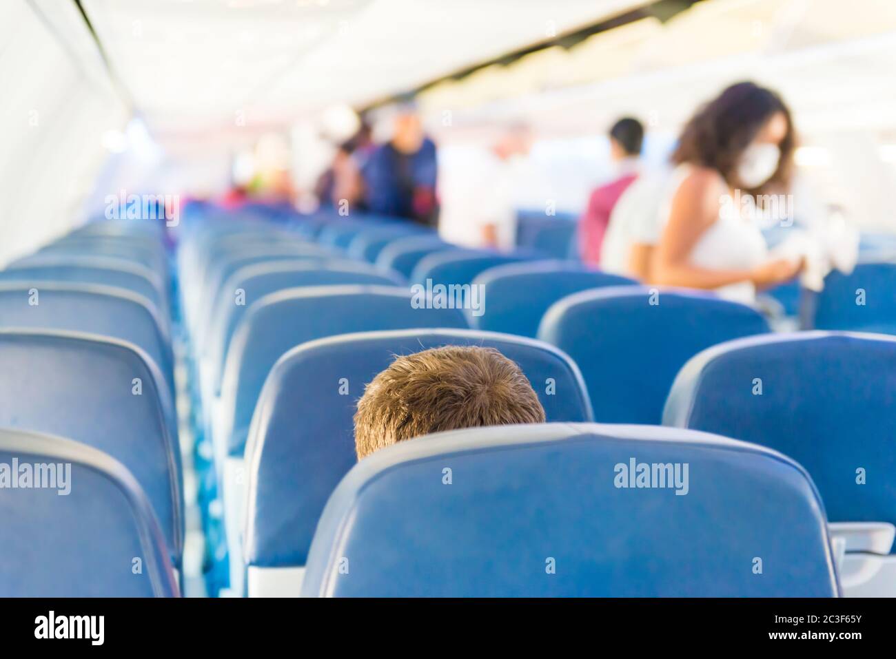 Empty plane interior with few people Stock Photo