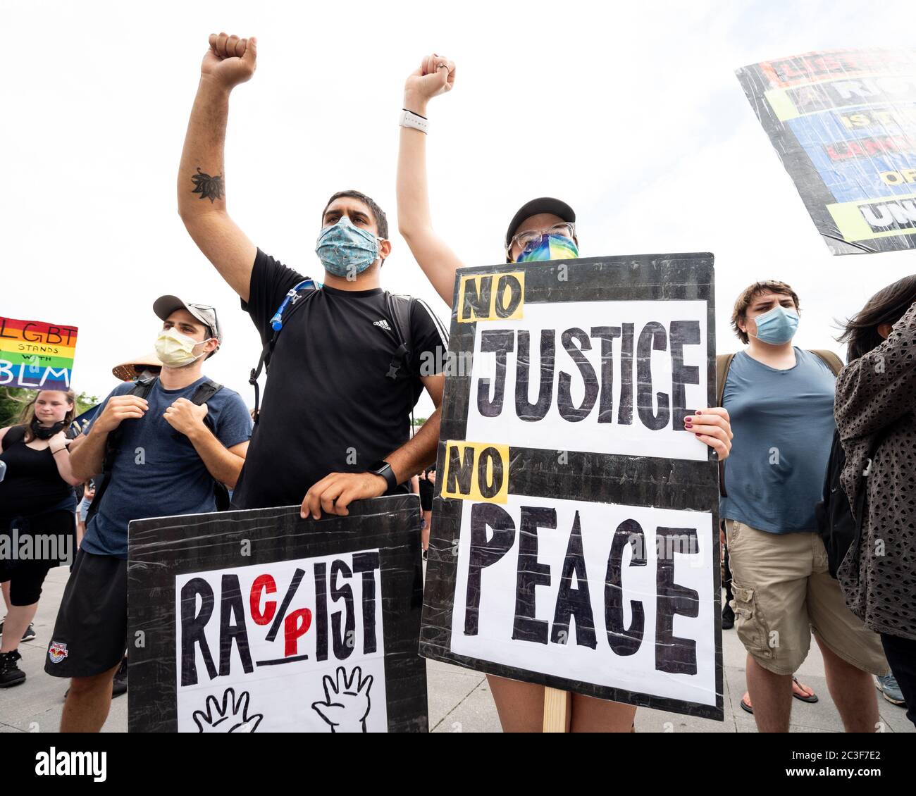 Washington, United States. 19th June, 2020. June 19, 2020 - Washington, DC, United States: Woman with a sign reading 'No Justice No Peace' at a Juneteenth Freedom Day march and rally at the National Mall. (Photo by Michael Brochstein/Sipa USA) Credit: Sipa USA/Alamy Live News Stock Photo