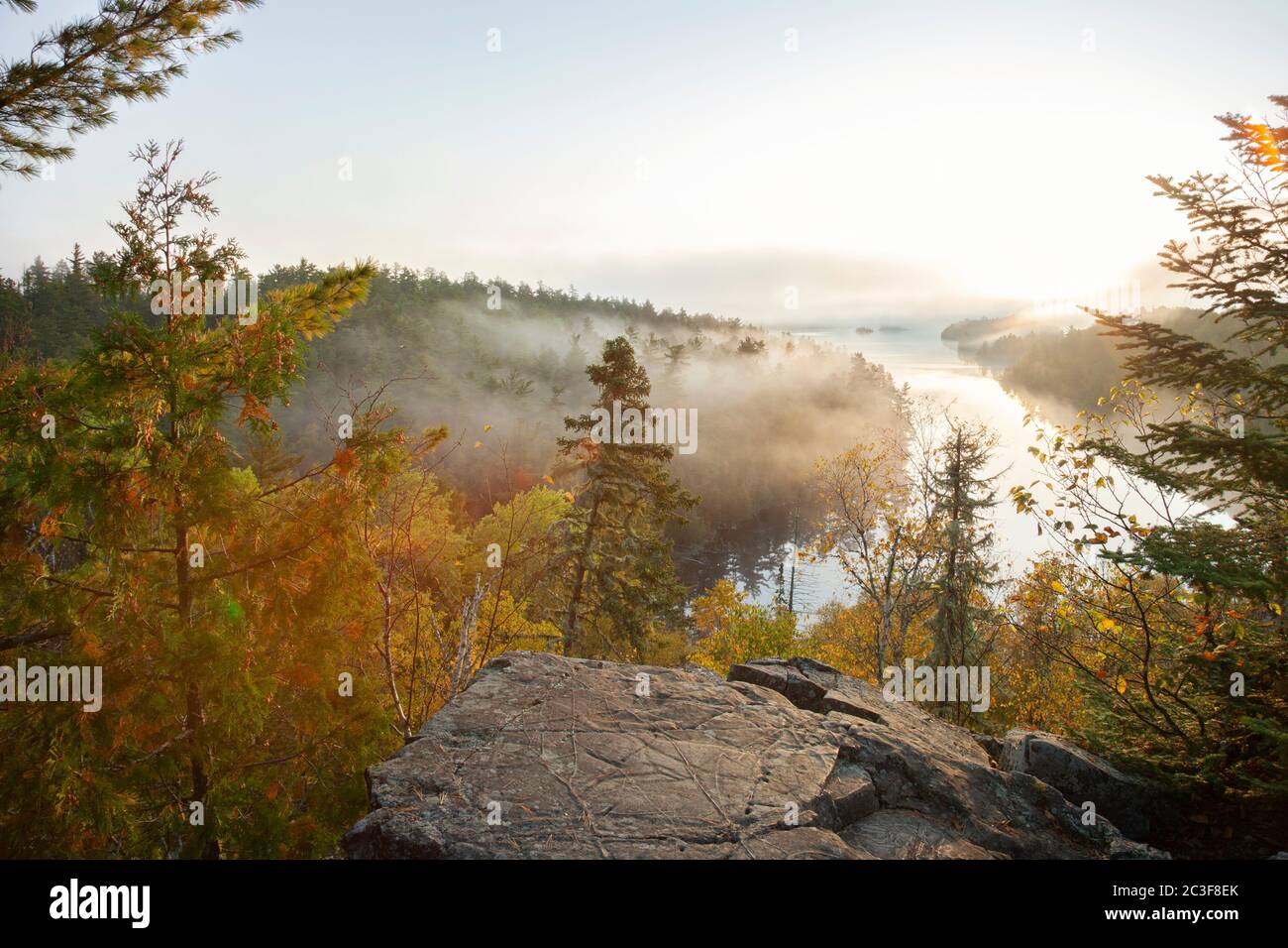Early morning view of a northern Minnesota lake with mist during autumn Stock Photo