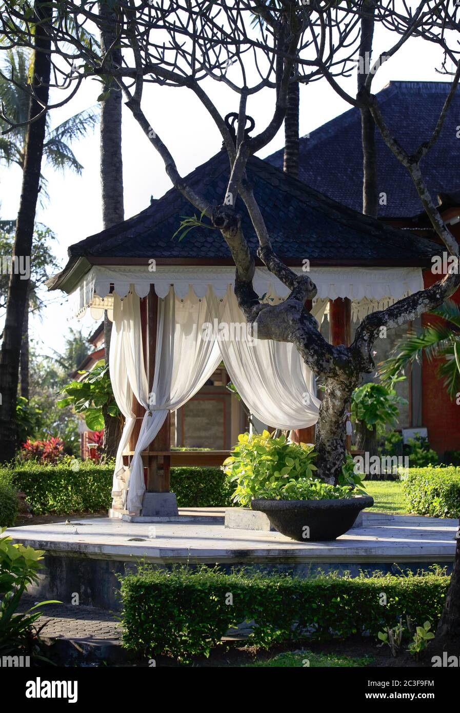 Arbor with white curtains for relaxation or meditation. Bali Island, Indonesia Stock Photo